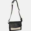 Black shoulder bag with wide bag strap. The bag is made of leather and still has white details.